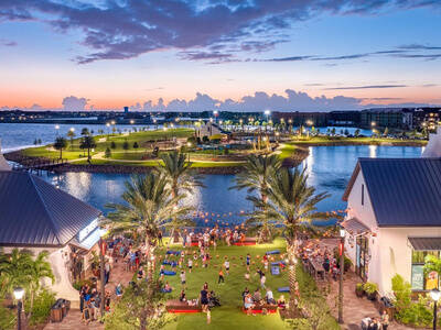 An evening community event at Lakewood Ranch's Waterside, on the water.